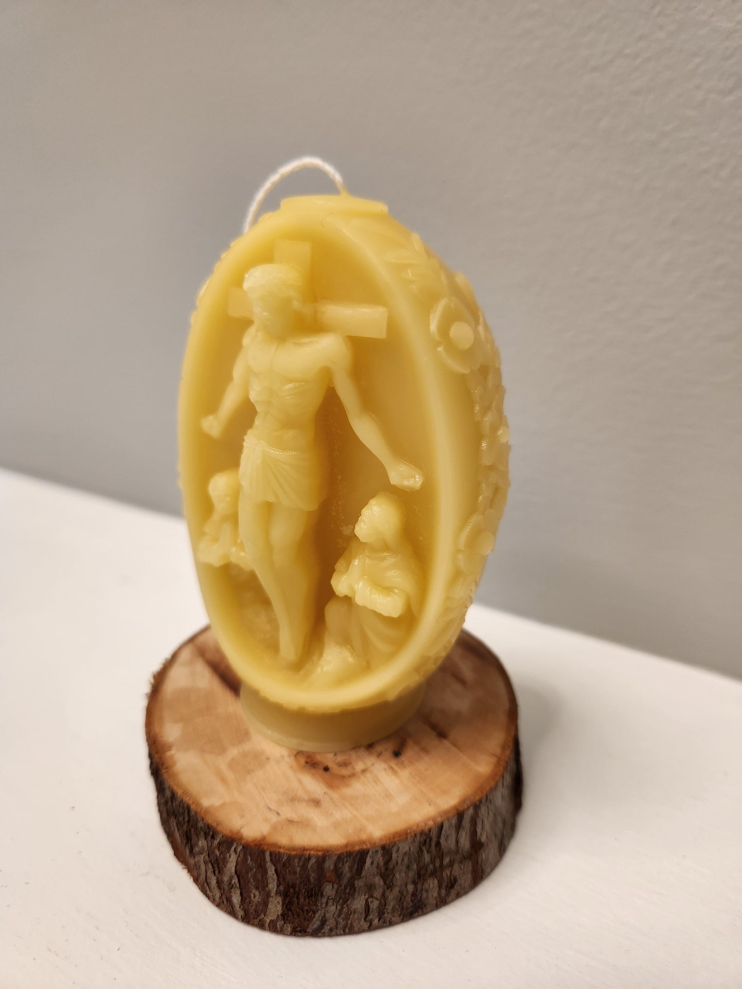 Embossed beeswax Floral pillar with Christ on crucifix