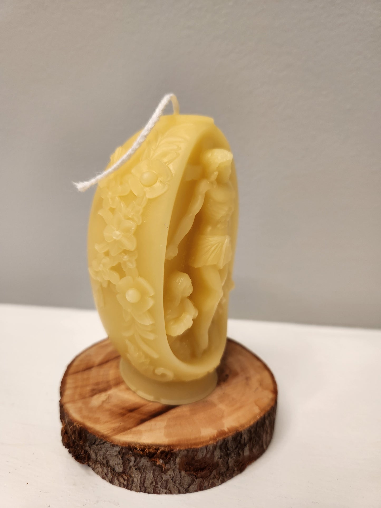 Embossed beeswax Floral pillar with Christ on crucifix