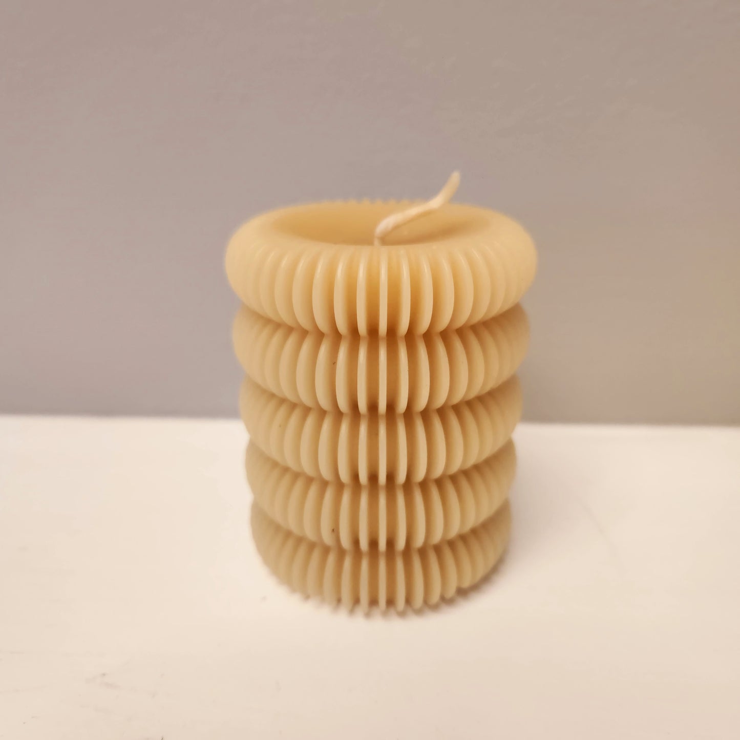Scalloped beeswax pillar candle