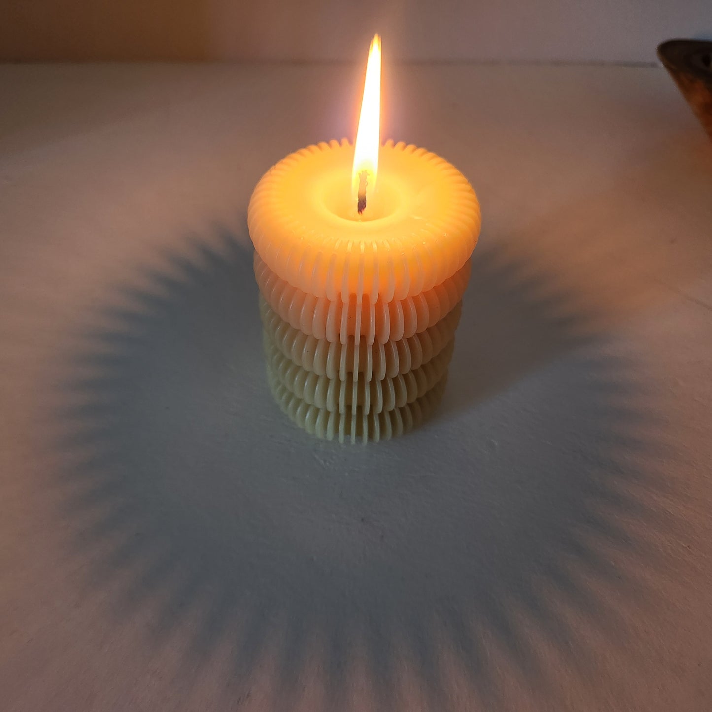 Scalloped beeswax pillar candle