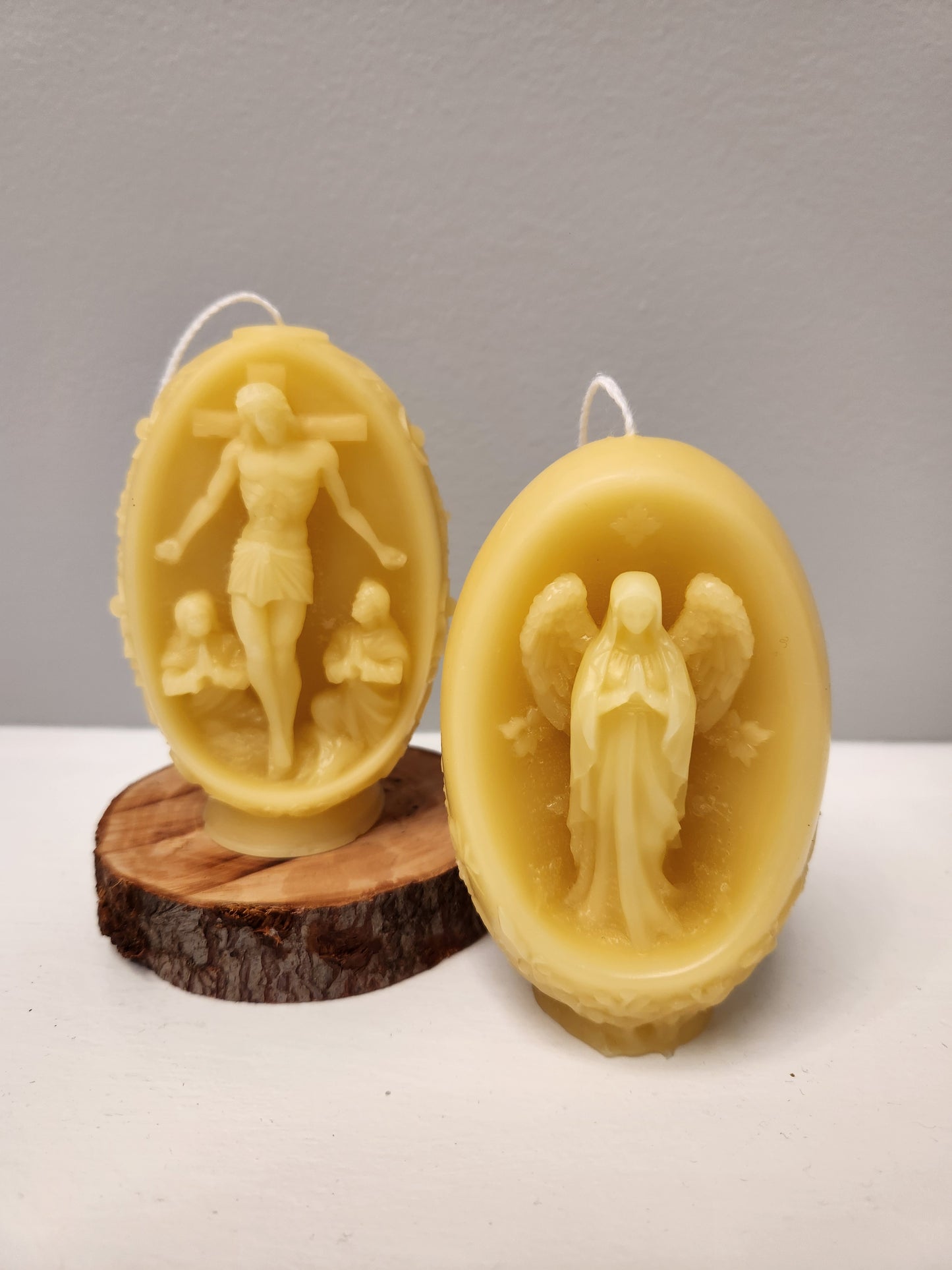 Embossed beeswax Floral pillar with  Christ on crucifix
