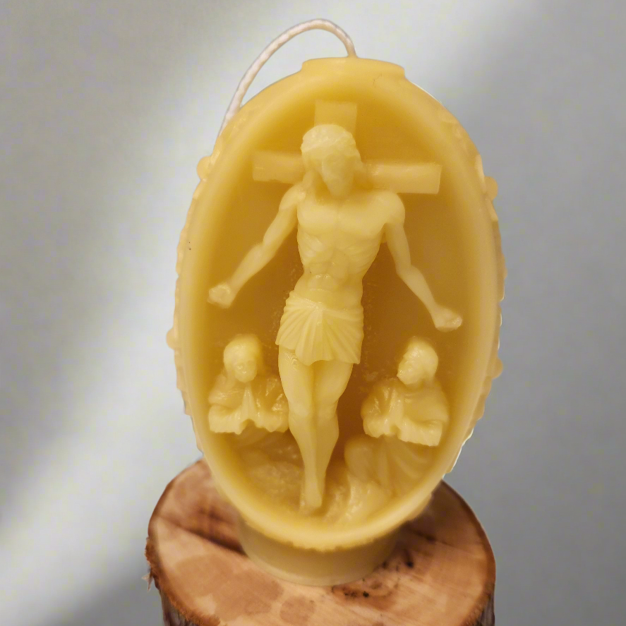 Embossed beeswax Floral pillar with  Christ on crucifix